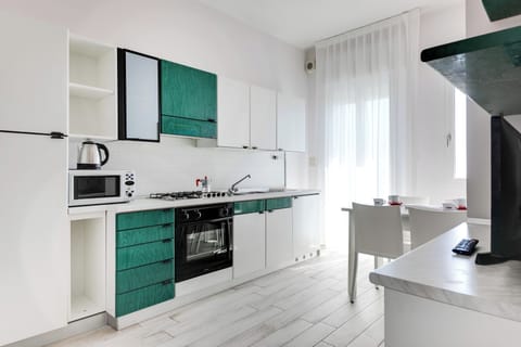 Appartamento Brigantino | Private kitchen | Full-size fridge, microwave, oven, stovetop