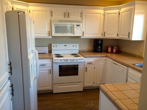 Kitchen with large capacity fridge, ice maker. Well equipped kitchen with spices