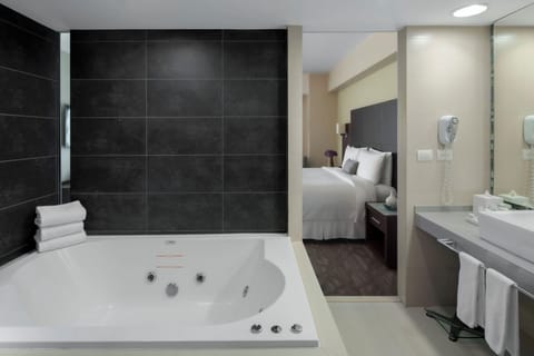 Suite | Bathroom | Designer toiletries, hair dryer, bathrobes, towels