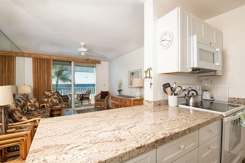 Enjoy a tastefully upgraded kitchen with modern appliances, ample counter space, and island-inspired style.