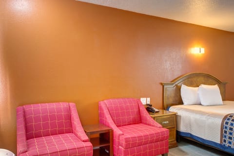 Standard Room, 1 King Bed | Living area | 42-inch LED TV with digital channels, TV