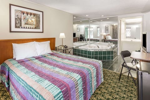 Suite, 1 King Bed, Jetted Tub | Desk, iron/ironing board, cribs/infant beds, rollaway beds