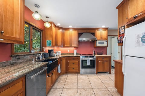 Stainless steel appliances & custom counters.