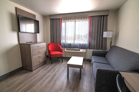 Family Suite, 1 King Bed, Non Smoking, Refrigerator & Microwave | Desk, laptop workspace, blackout drapes, soundproofing