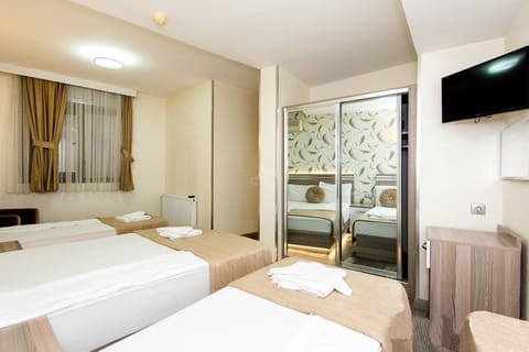 Standard Quadruple Room | Premium bedding, in-room safe, desk, free WiFi