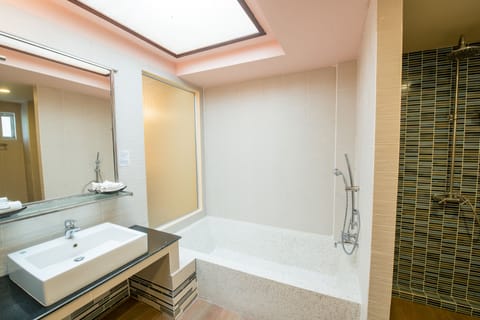 Junior Suite, Sea View | Bathroom | Shower, designer toiletries, hair dryer, bathrobes