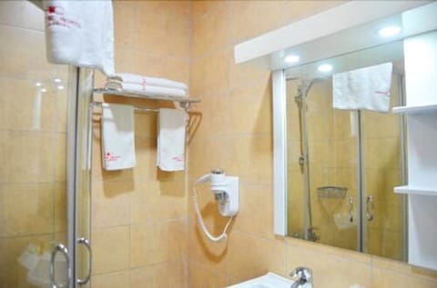 Standard Room | Bathroom | Free toiletries, slippers, towels