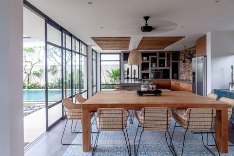 Indoor dining area with square dining table that can seat 10 persons.