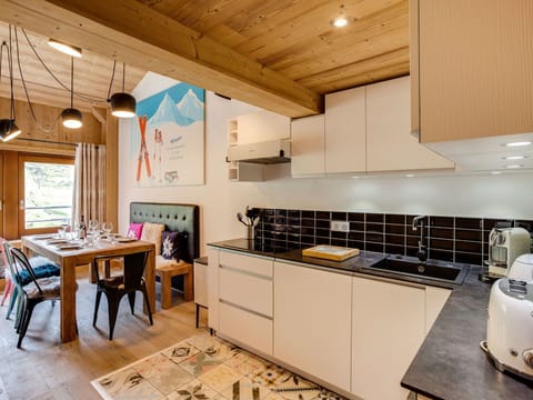 Room, Property, Kitchen, Furniture, Countertop, Interior Design, Building, Ceiling, Cabinetry, Yellow