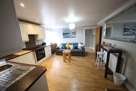 Deluxe Apartment, 1 Bedroom | Living area | Flat-screen TV, Netflix, streaming services