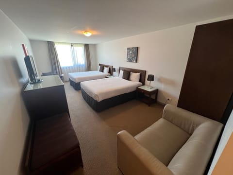 Deluxe Twin Queen Suite | Minibar, in-room safe, iron/ironing board, free WiFi