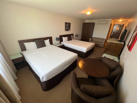 Deluxe Twin Queen Suite | Minibar, in-room safe, iron/ironing board, free WiFi