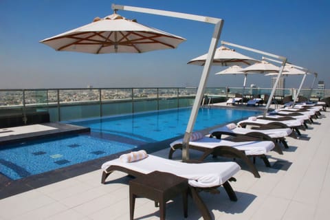 Outdoor pool, pool umbrellas, sun loungers