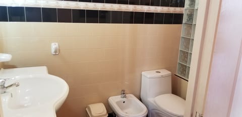 Deluxe Room (#3) | Bathroom | Shower, towels, soap, toilet paper