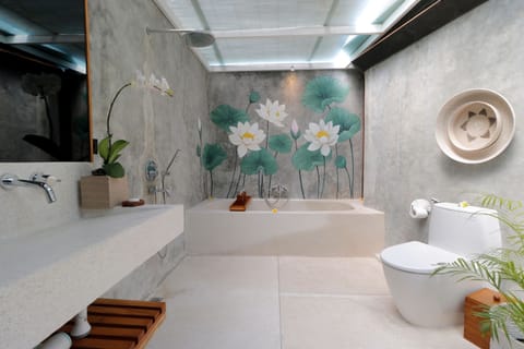 Combined shower/tub, deep soaking tub, hair dryer, bathrobes