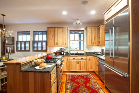 Chef's kitchen with gas range and dishwasher.