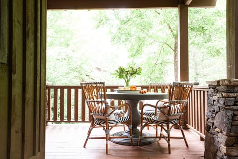Dine in the fresh mountain air on the wrap-around porch.