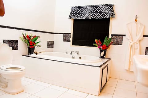 Premium Suite, 1 King Bed, Ocean View (Jacuzzi) | Bathroom | Combined shower/tub, free toiletries, hair dryer, bathrobes