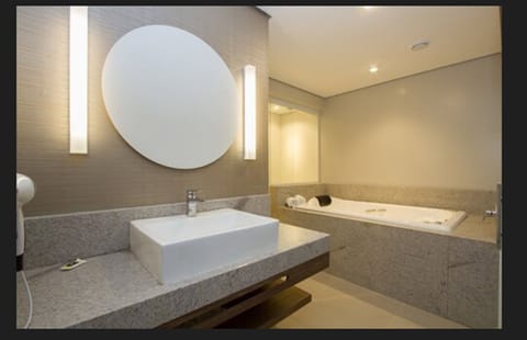 Superior Suite, 1 King Bed, Hot Tub | Bathroom | Shower, free toiletries, hair dryer, towels