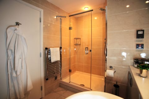 Separate tub and shower, designer toiletries, hair dryer, towels