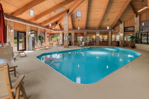 Indoor pool, open 7:00 AM to 11:00 PM, pool umbrellas, sun loungers