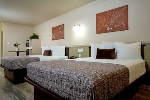 2 Queen Main Building Downstairs | Blackout drapes, soundproofing, rollaway beds, free WiFi
