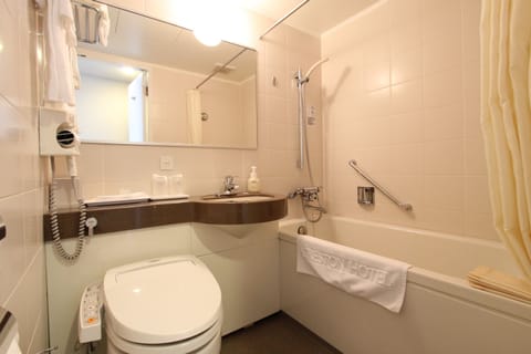 Combined shower/tub, free toiletries, hair dryer, slippers