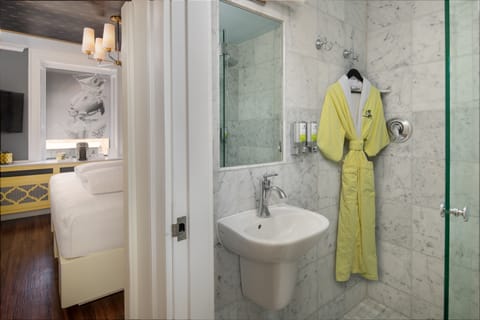 Shower, designer toiletries, hair dryer, bathrobes