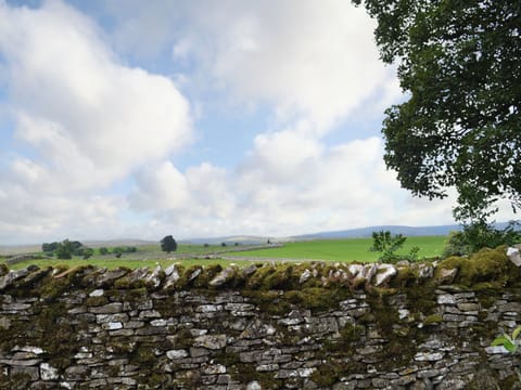 There are expansive views over rural countryside towards the distant hills | The Rockery - Rockery Cottages, Shap, near Penrith