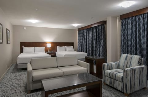 Junior Suite, 2 Queen Beds | Living area | 55-inch LCD TV with cable channels, TV, pay movies