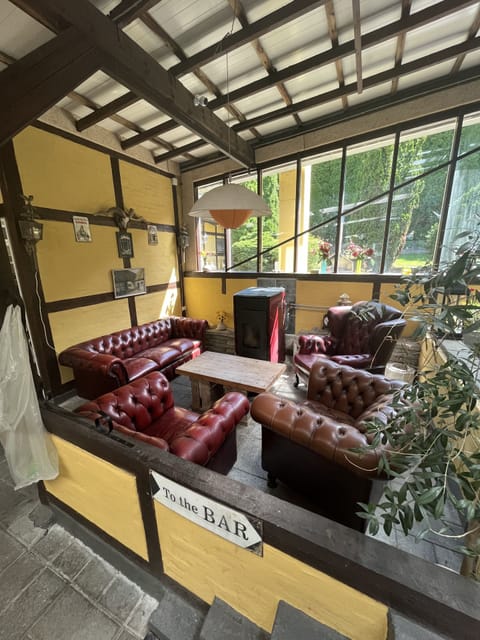 Basic Twin Room, Private Bathroom | Living area | Flat-screen TV