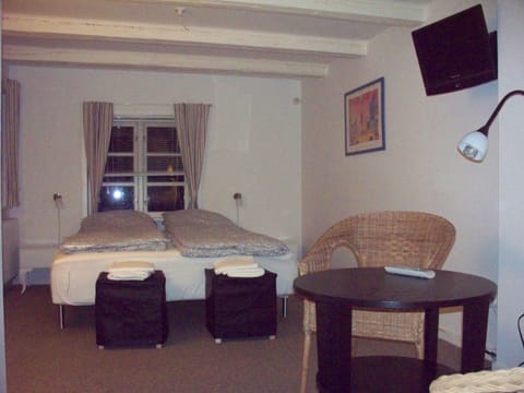 Basic Double Room, Shared Bathroom | In-room safe, individually decorated, individually furnished