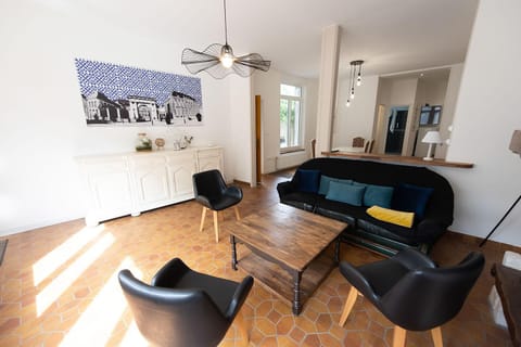 Quadruple Room | Living area | Flat-screen TV