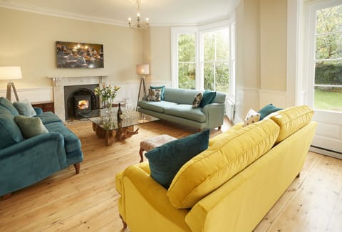 Ground floor: Spacious open-plan sitting room with wood burning stove