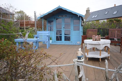 Summer house with fridge, kettle and lamp