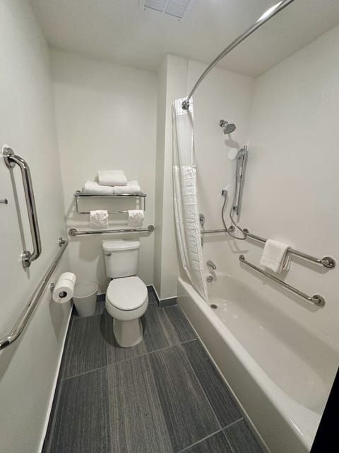 Room, 1 King Bed, Accessible (Hearing) | Bathroom | Combined shower/tub, hair dryer, towels