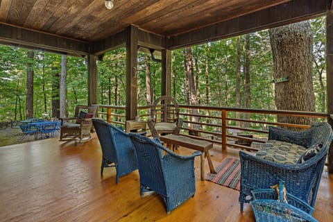 Enjoy a massive COVERED FRONT PORCH with tons of seating and WINTER LAKE VIEWS.