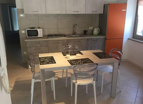 Panoramic Condo | Private kitchen | Fridge, microwave, stovetop, electric kettle