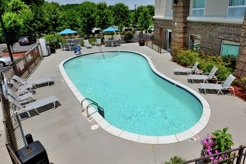 Seasonal outdoor pool, open 9:00 AM to 10:00 PM, pool umbrellas