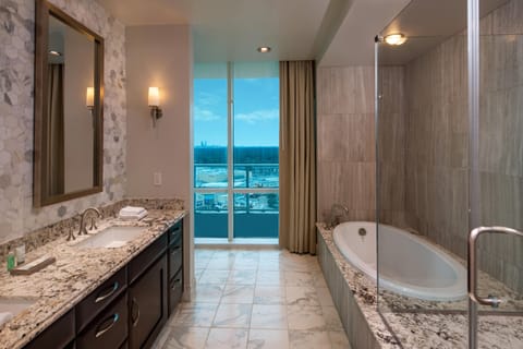 Combined shower/tub, deep soaking tub, hair dryer, bathrobes