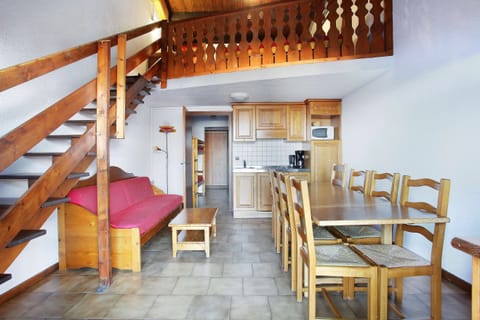 Prepare meals in the kitchenette and enjoy them at the dining table.