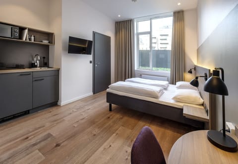 Studio, 1 Queen Bed, Kitchenette, City View | Desk, laptop workspace, soundproofing, free WiFi