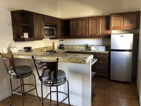 Studio, 1 Queen Bed | Private kitchen | Full-size fridge, microwave, stovetop, coffee/tea maker