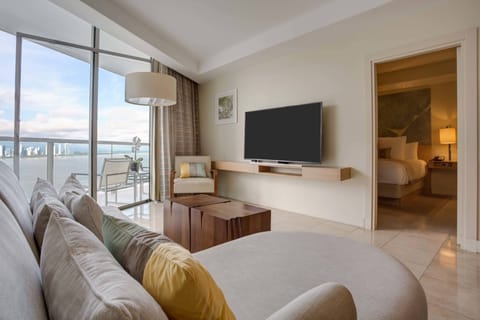 Grand Suite, 1 King Bed, Partial Ocean View | Living area | LCD TV, pay movies