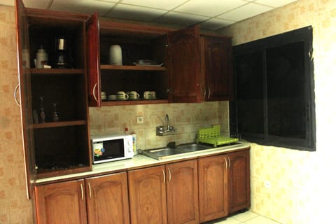 Apartment, 2 Bedrooms | Private kitchen | Fridge, microwave, stovetop, coffee/tea maker