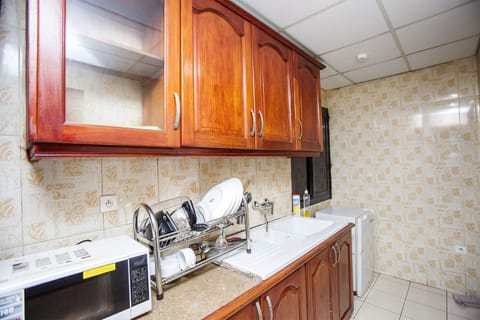 Apartment, 2 Bedrooms | Private kitchen | Fridge, microwave, stovetop, coffee/tea maker