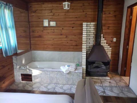 Superior Cabin, Jetted Tub | Living area | TV, fireplace