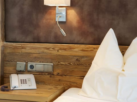 Hypo-allergenic bedding, down comforters, minibar, in-room safe