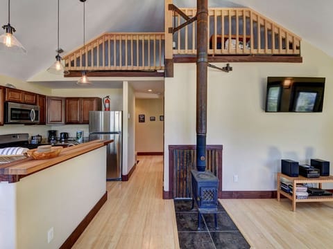 Looking up at loft from living room