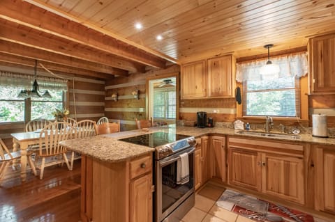 Enjoy ample seating and counter top space with this rustic kitchen.